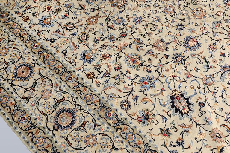 A Keshan carpet, signed, approx. 410 x 323 cm.