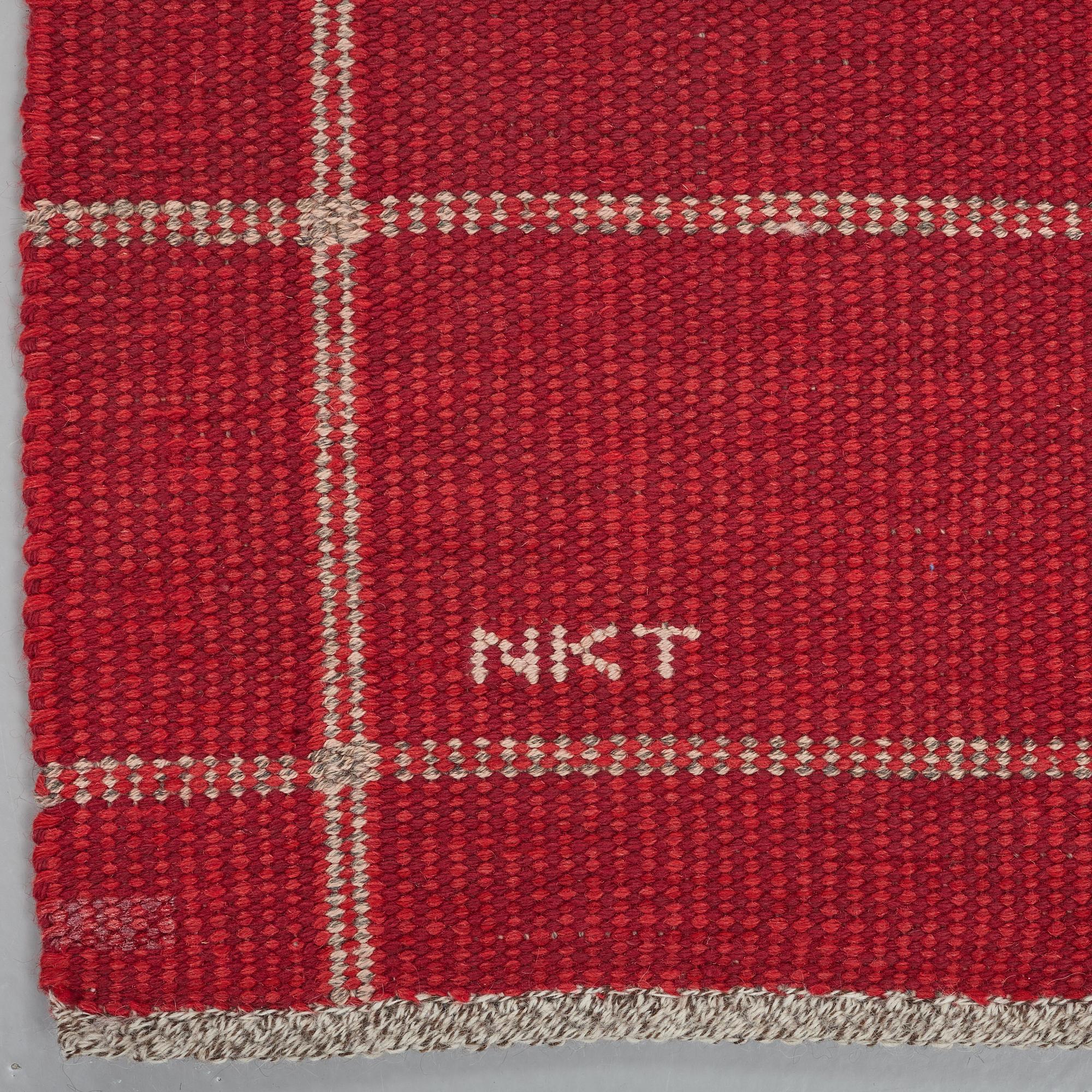 A CARPET, flat weave, ca 234,5 x 170,5 cm, signed NKT (Nordiska Kompaniets Textilkammare).