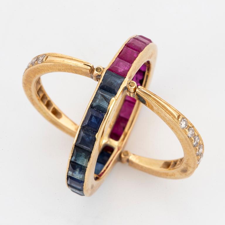 Calibre-cut ruby and sapphire and brillint-cut diamond ring.
