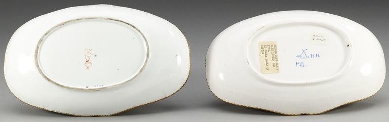 Two Sèvres sauce tureens on stands, 18th Century, one soft paste, dated HH for 1785.