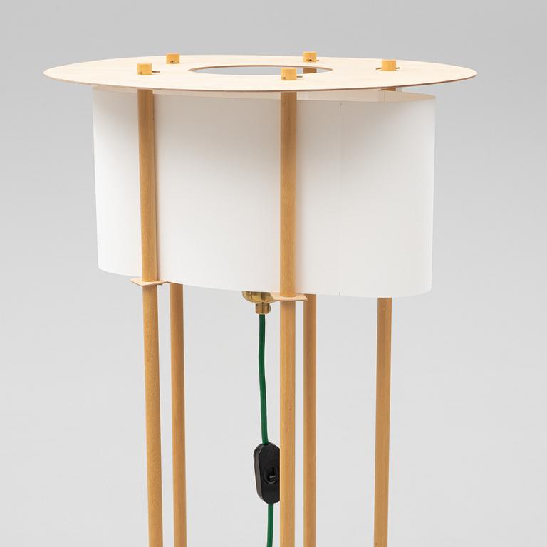 Torbjörn Ahlström, a pair of birch floor lights, dated 1993.