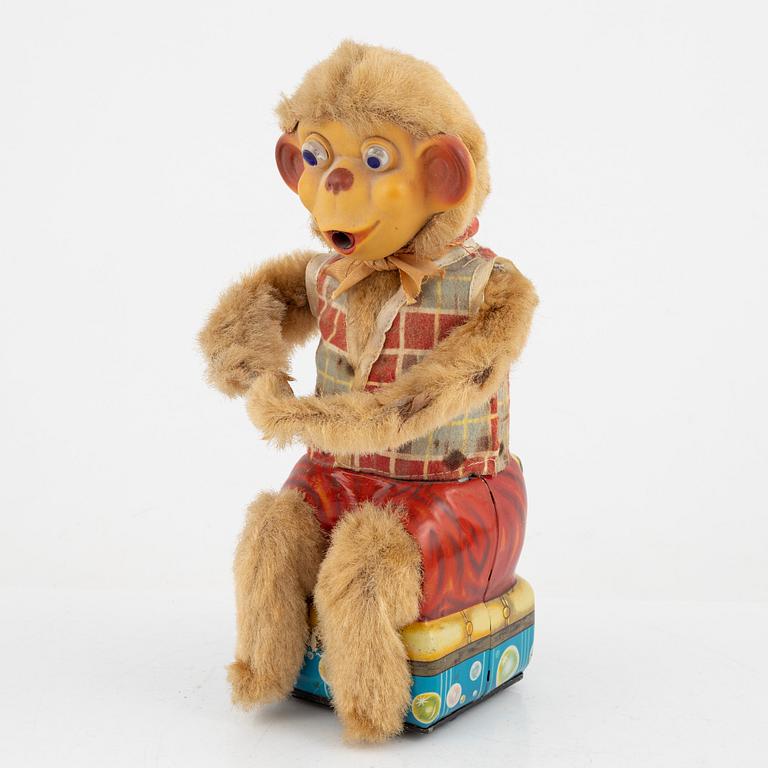 A set of five toys, including 'Rolly' clown from Schuco, 20th century.