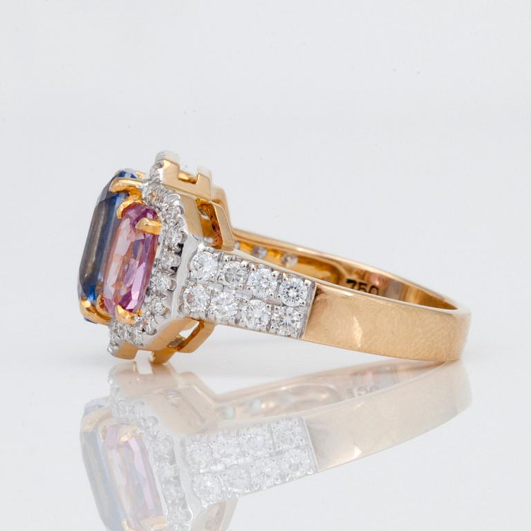 A 5.87 ct blue, pink and yellow sapphire and 0.76ct diamond ring.