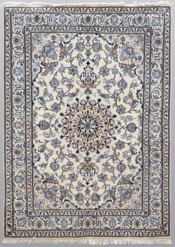 A rug, Nain part silk, ca 235 x 160 cm.