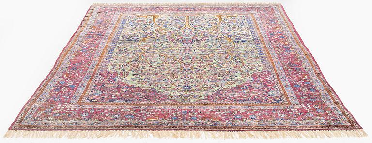 An antique silk Kashan carpet, central Persia, c. 319 x 206 cm.