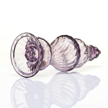 An amethyst coloured suger shaker and a cut glass goblet, 18th century.