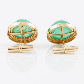 Cufflinks, a pair, 14K gold with cabochon-cut emeralds.