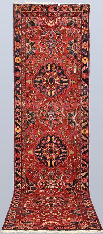 A semi-antique Heriz runner, c. 340 x 92 cm.