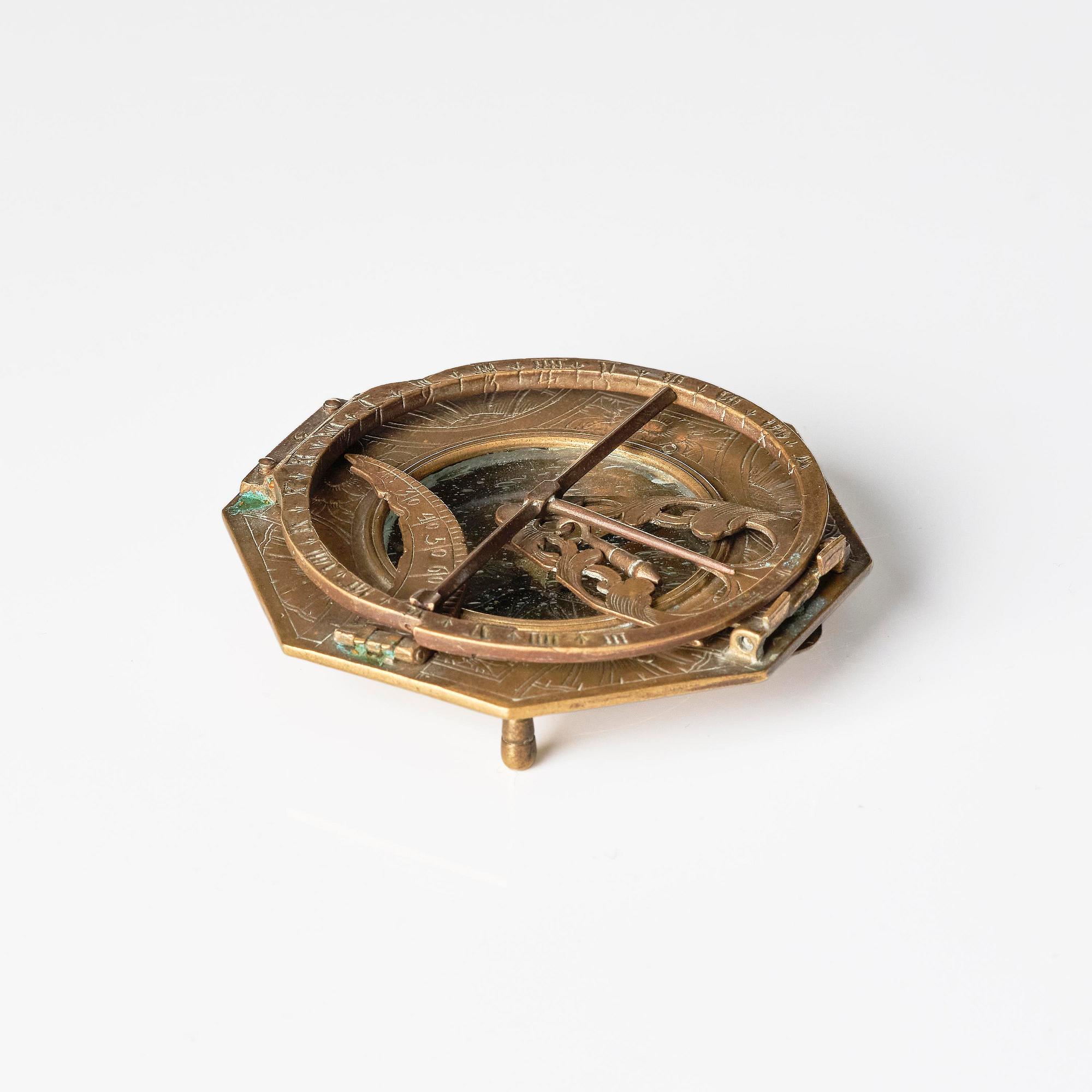 An engraved brass octagonal equinoctial compass sundial by Andreas Vogler (Augsburg, c. 1766-90).