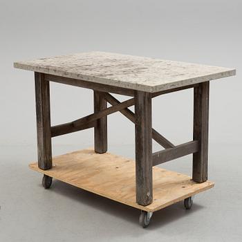 A Limestone and wood table.