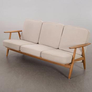 HANS J WEGNER, a Cigarren oka sofa Getama möbler Denmark later part of the 20th century.