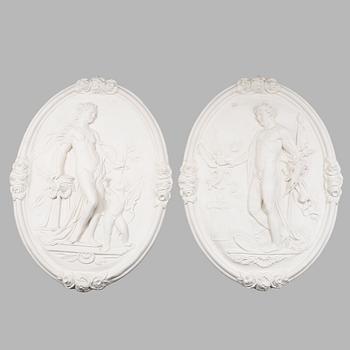 VÄGGRELIEFER, 2 st, gips, 1900-tal.