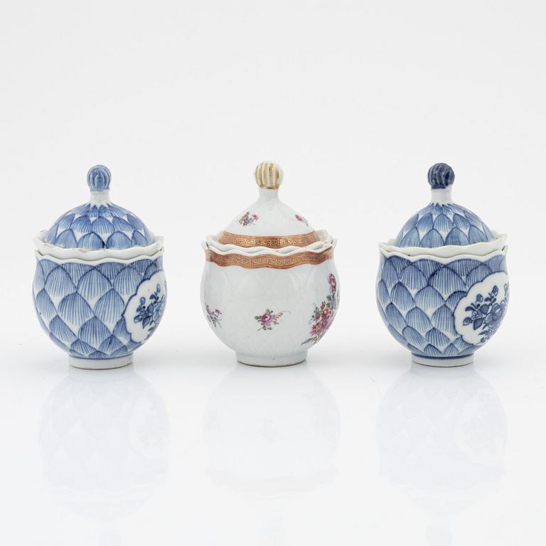 A set of two blue and white custard cups and a famille rose custard cup, Qing dynasty, Qianlong (1736-95).