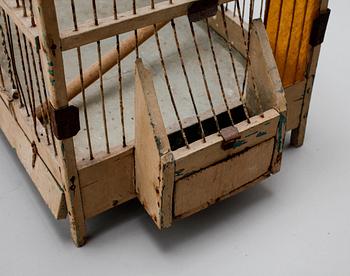 A bird cage from around the year of 1900.