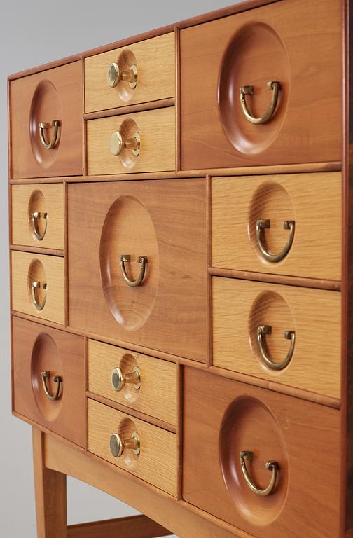 A Josef Frank cabinet on stand with thirteen different size  drawers,