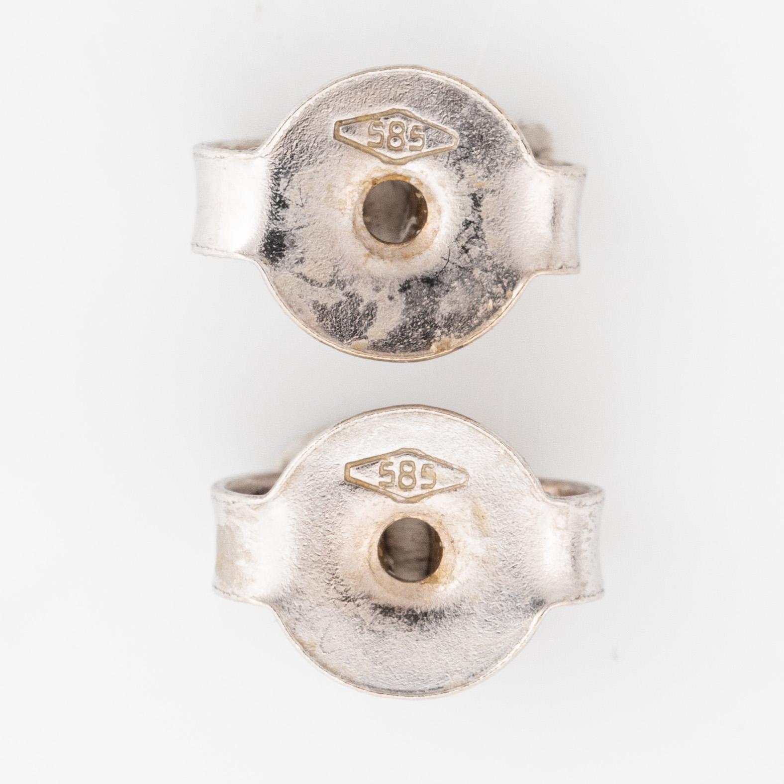 Colour treated brilliant cut diamond earrings.