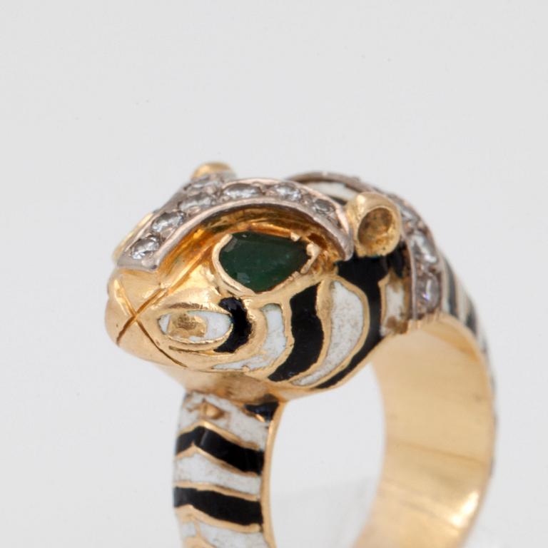 A diamond, enamel and emerald ring and bangle.