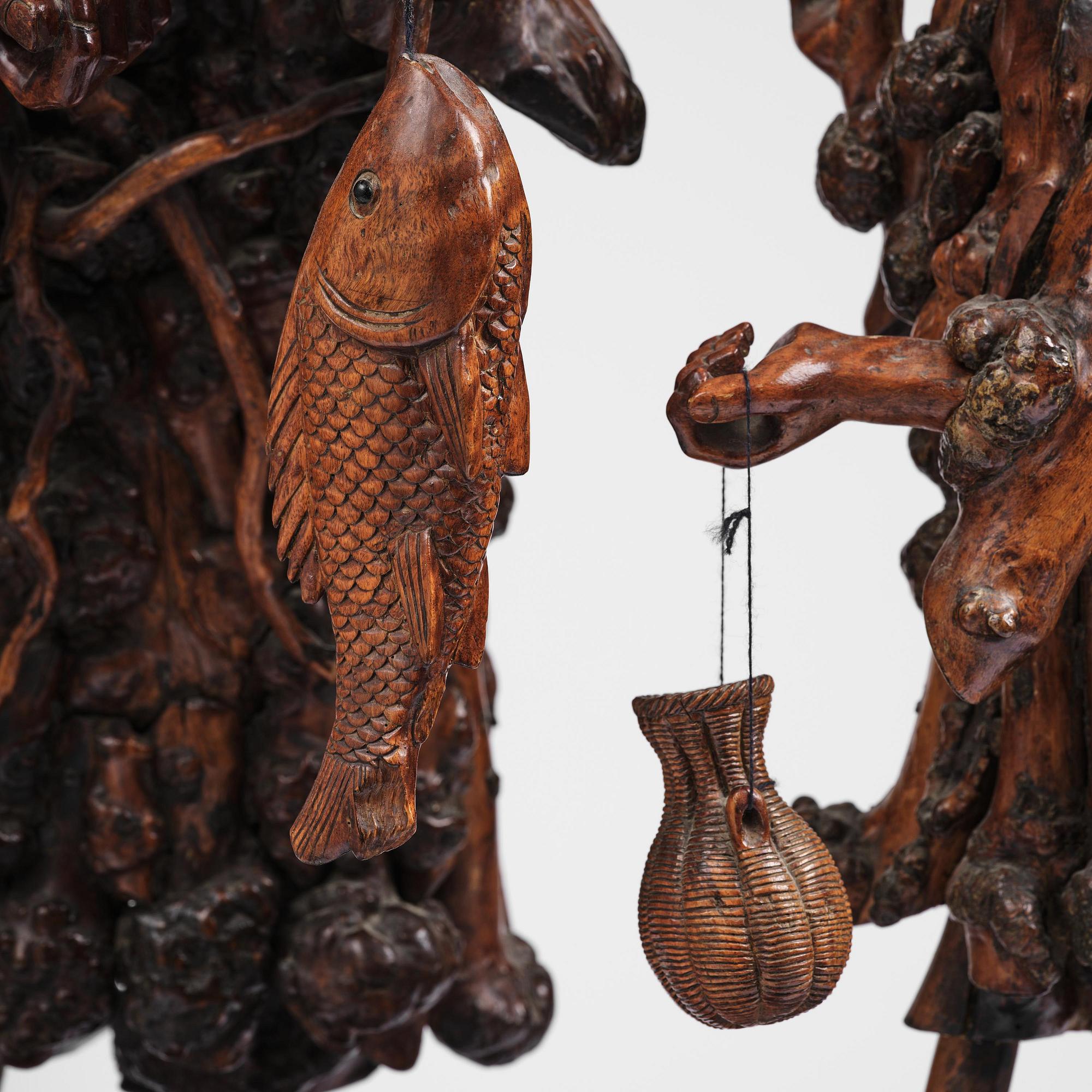 A large well sculptured root sculpture of 'Sholau and attendant', late Qing dynasty, 19th century.