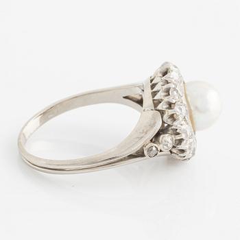 An 18K white gold ring set with a bouton pearl and old-cut diamonds.