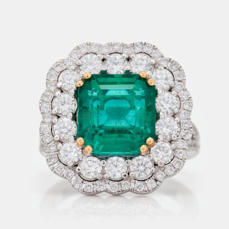 A 5.35ct zambian emerald (minor oil) and brilliant cut diamond ring. Certificate from Donneger.