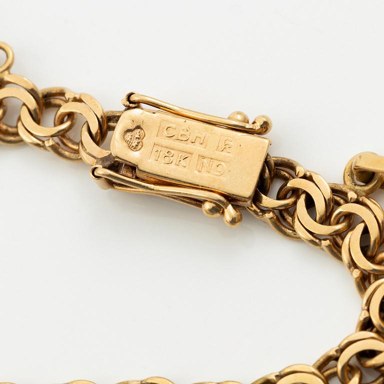 Bracelet, 18K gold with charms.
