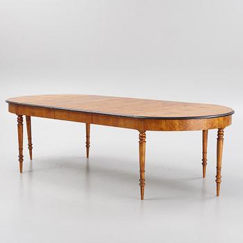 A birch veneered dining table, second half of the 19th Century.