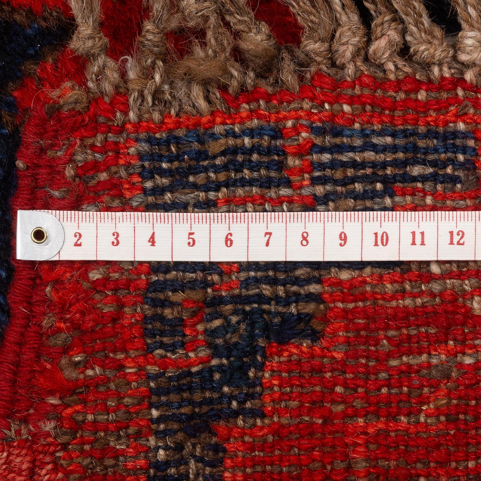 An antique Central Asian carpet, possibly Kirghiz, c. 346 x 154 cm.