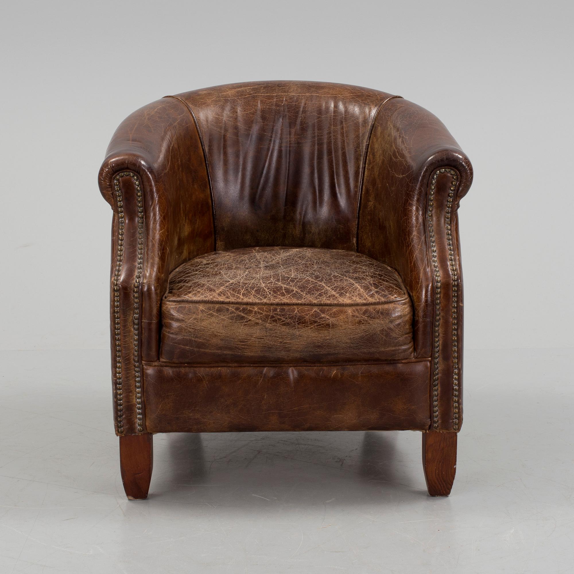 A leather club lounge chair by Newport, ca 2000.
