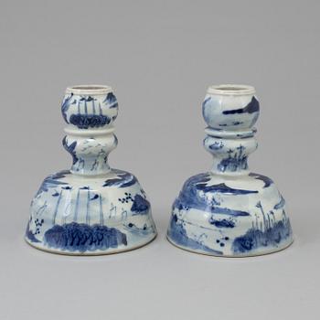A pair of blue and white candlesticks, late Qingdynasty.