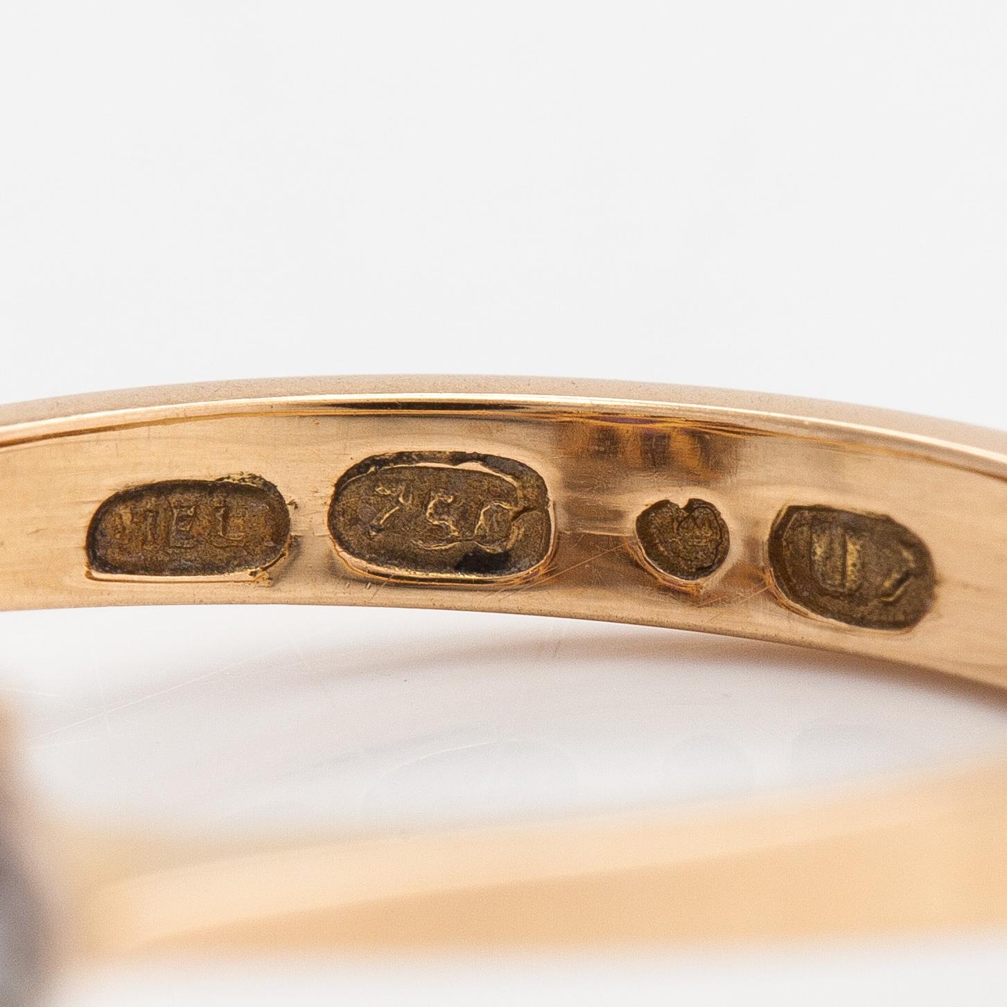 An 18K gold ring with an amethyst and diamonds ca. 0.15 ct in total. H. Lahtinen & Co, Helsinki 1973.
