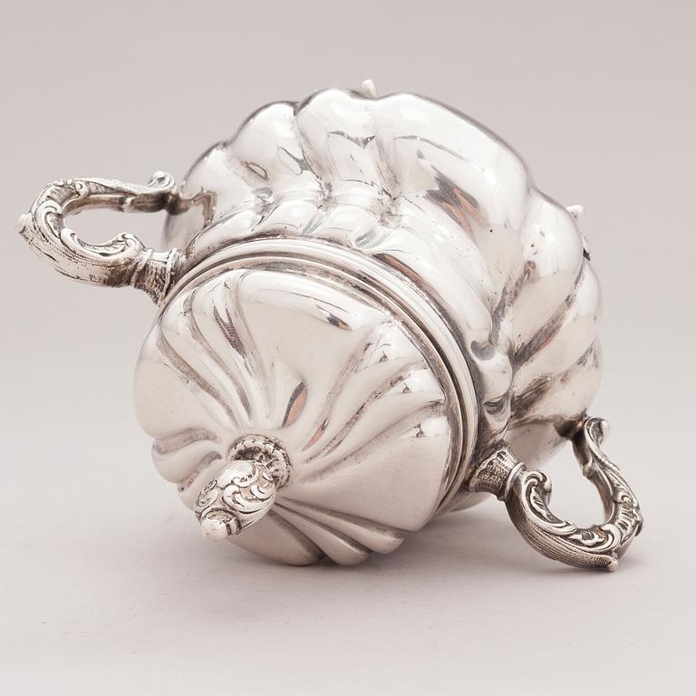 A lidded silver sugar bowl and a set of six silver bowls, Germany.