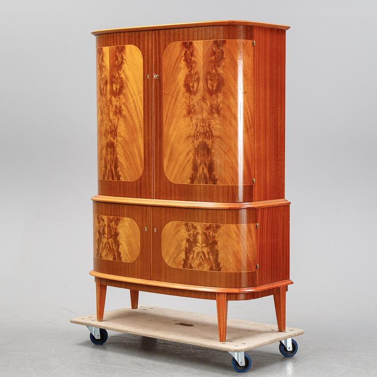 A mahogany veneered cabinet, mid 20th Century.