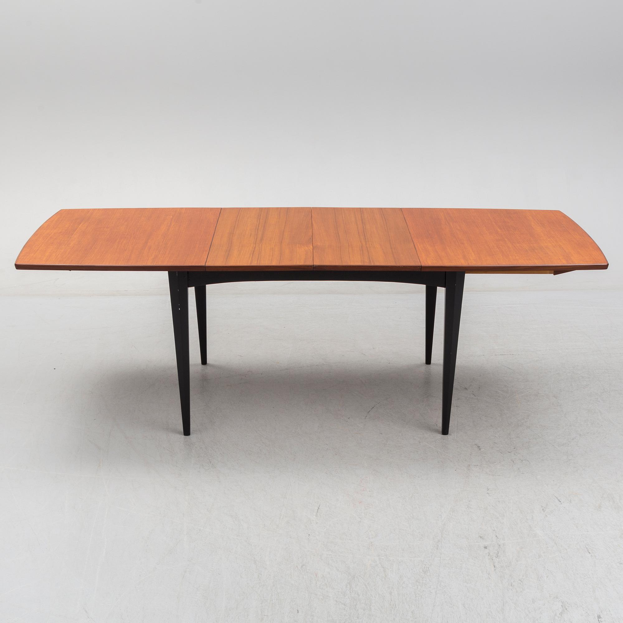 A 1950s/1960s teak and teak veneer table.
