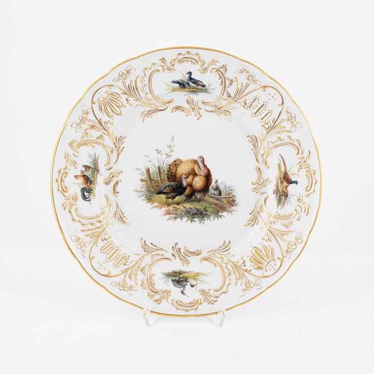 A set of five Meissen porcelain games plates, late 19th to early 20th century.