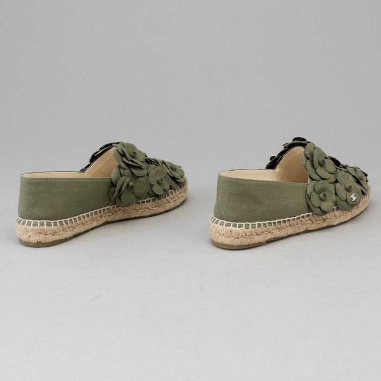 A pair of espadrilles from Chanel.