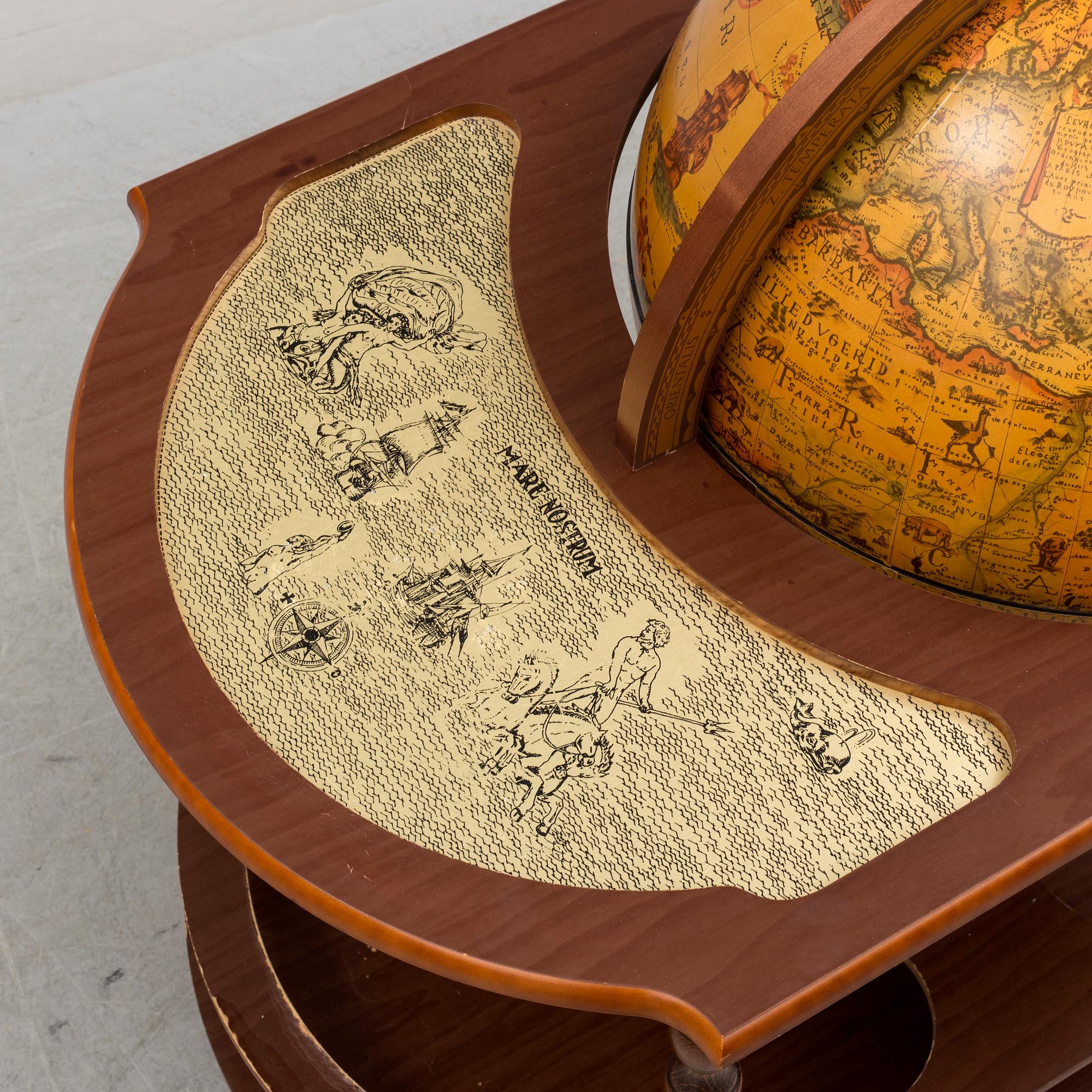 A globe shaped drinks cabinet, circa 2000.