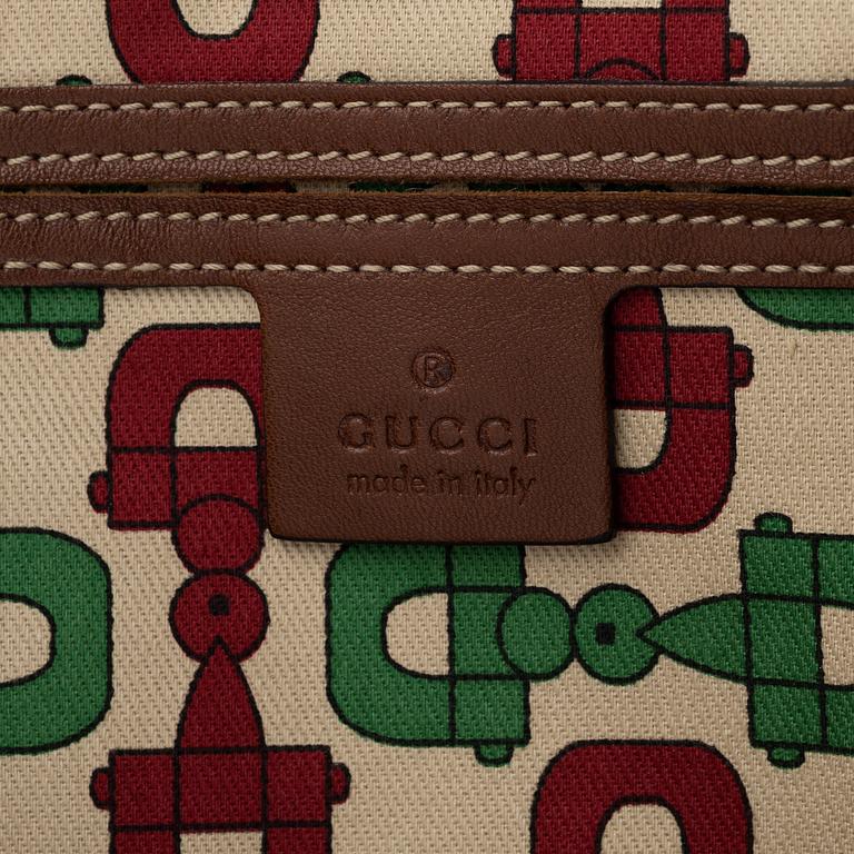 Gucci, a embossed leather bag.