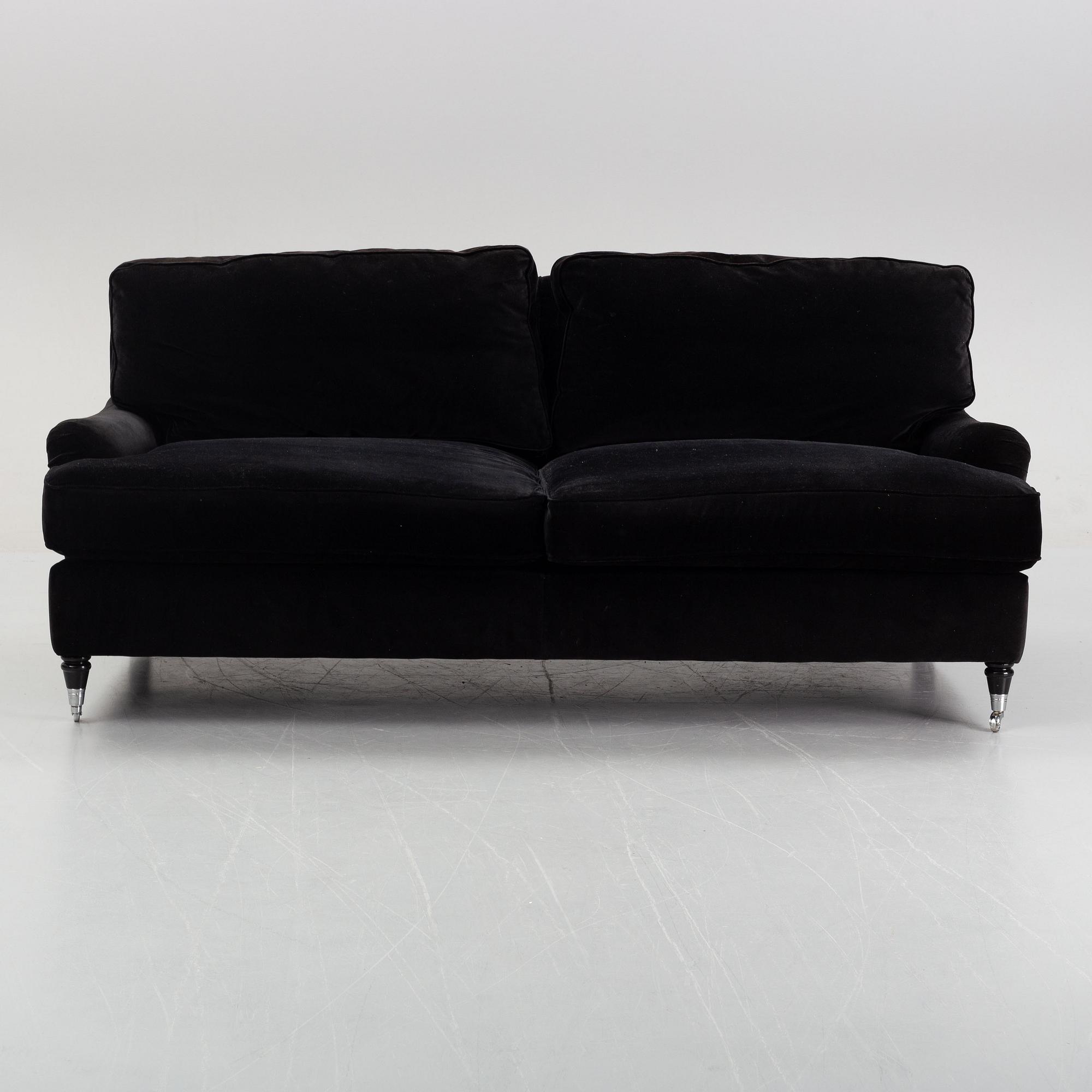 A contemporary velvet Howard sofa.
