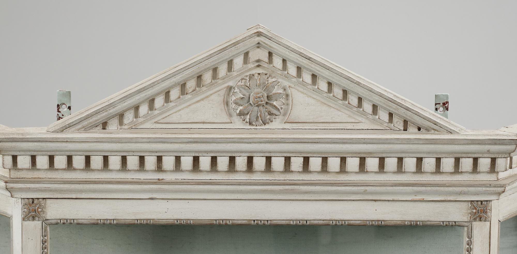 A Louis XVI-style vitrine, 20th century.