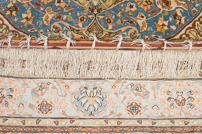 An oriental, silk rug, signed, c. 175 x 125 cm.
