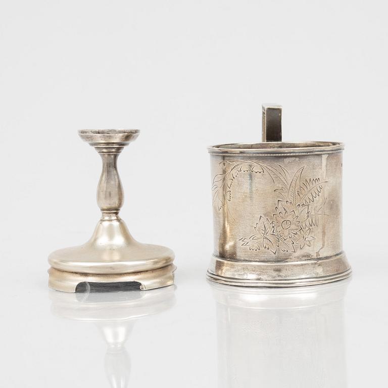A Russian Silver Candlestick, 1908-26, and a Russian Silver Tea Glass Holder, assay master A. Skovronsky, Moscow 1896.