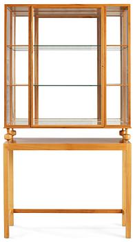 506. A Josef Frank cherrywood show case cabinet by Firma Svenskt Tenn.