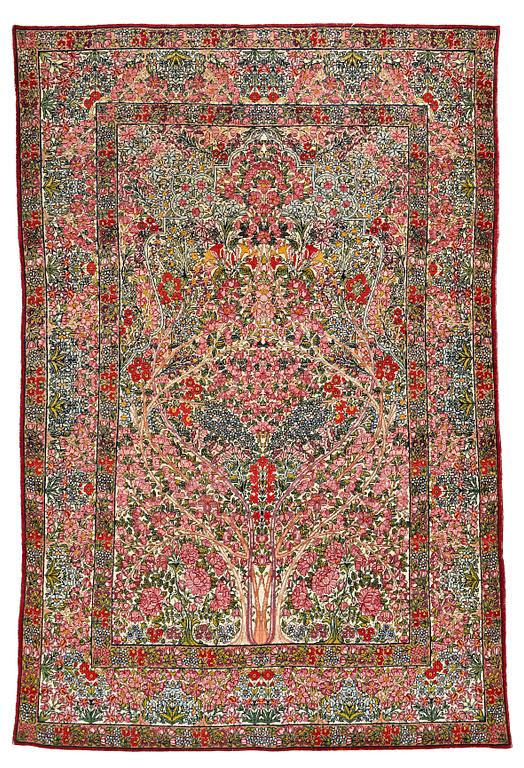 A RUG, a semi-antique Kerman "mille-fleur", ca 198,5 x 136,5 cm.