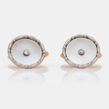 770. A pair of cufflinks with mother of pearl and diamonds.