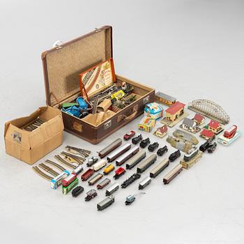 Märklin, among others, collection of locomotives, carriages, and accessories, 1950s-60s.