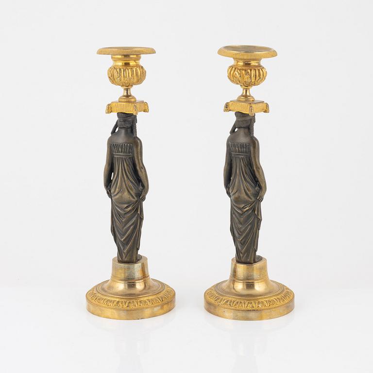 A pair of empire/style candlesticks.