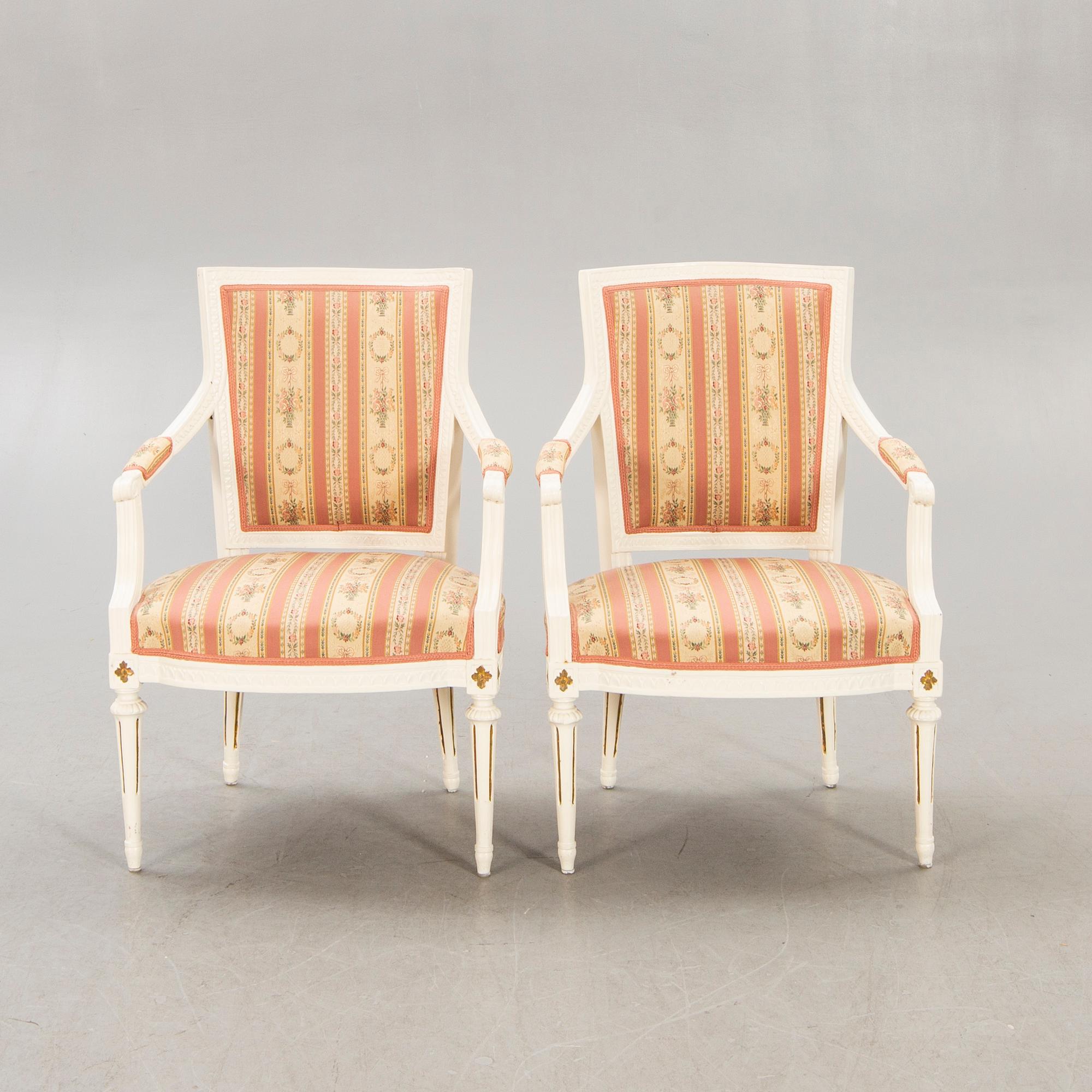 A pair of Swedish painted late Gustavian armchairs around 1800.