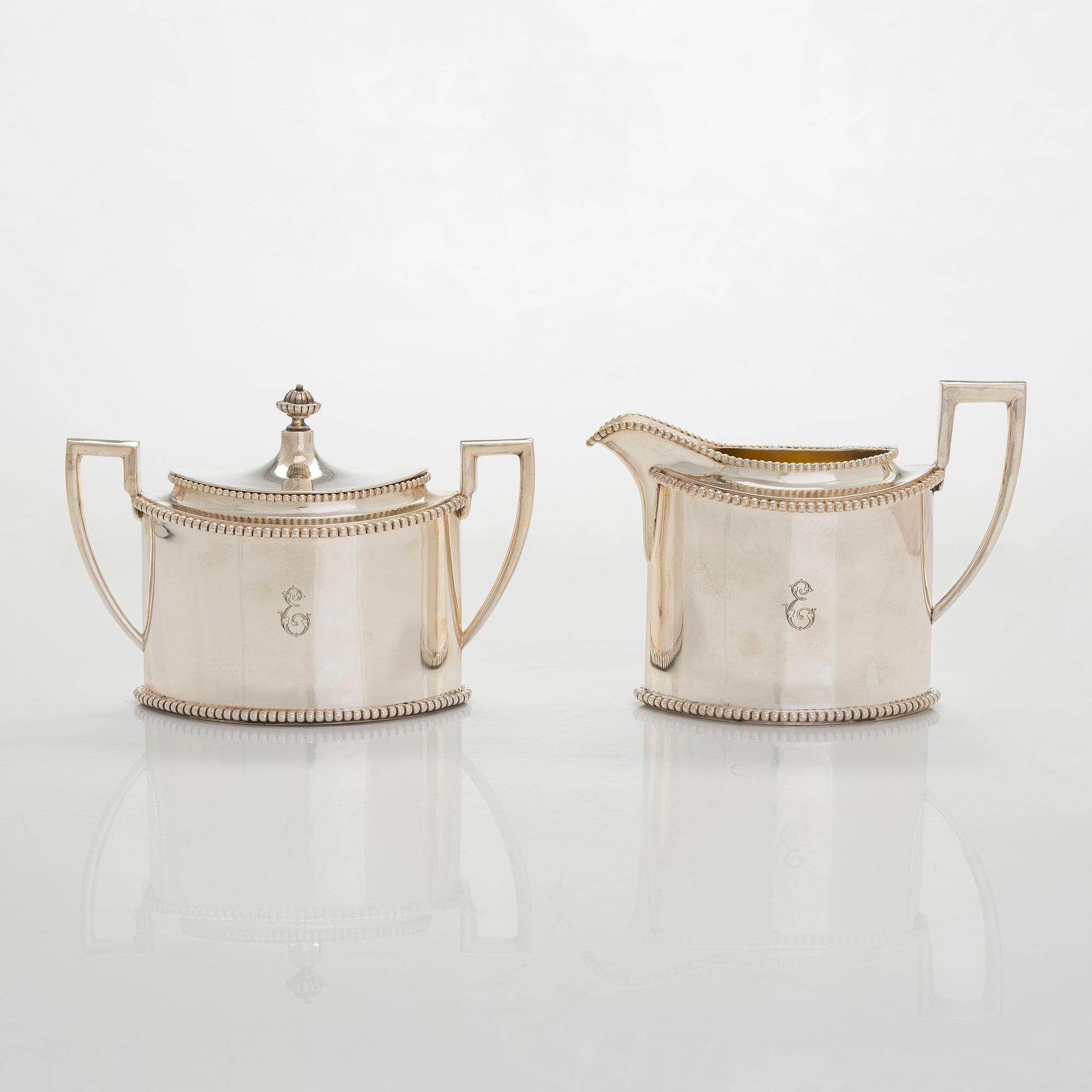 An early 20th century 4- piece sterling silver empire coffee set, C.G. Hallbergs Guldsmeds AB, Stockholm.