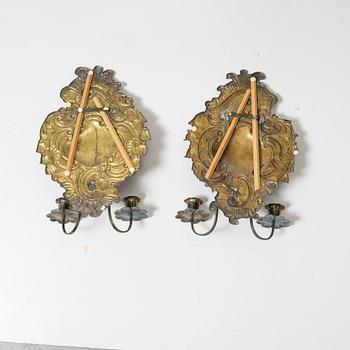 A pair of Rococo-style silver-plate sconces, early 20th century.