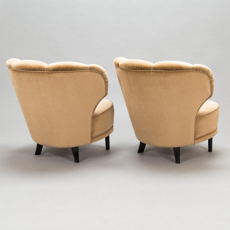 A pair of 1950's armchairs.